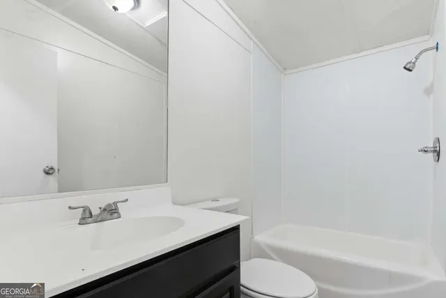 a bathroom with a sink toilet and bathtub