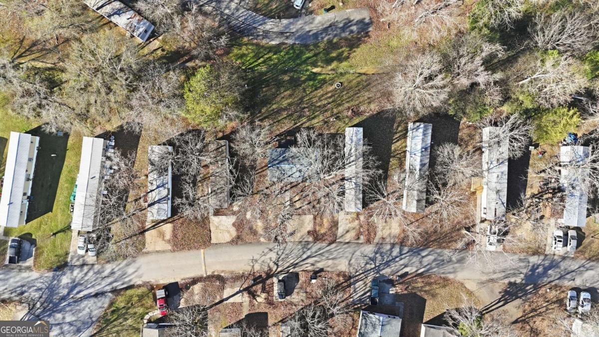 129 Rising Fawn Trail Northeast Rome, GA 30165 - Photo 21 of 25 a backyard of a house with large trees