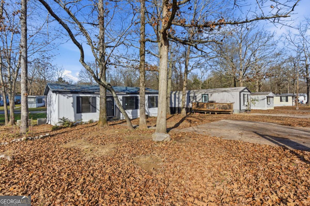 129 Rising Fawn Trail Northeast Rome, GA 30165 - Photo 3 of 25 a view of a house with a yard and large tree