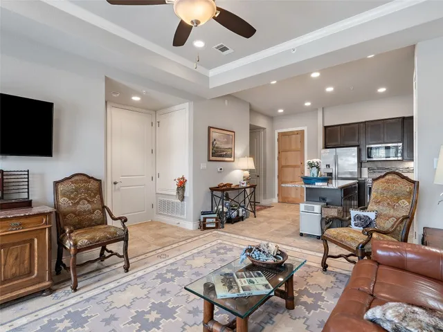 a living room with furniture or couch and a flat screen tv