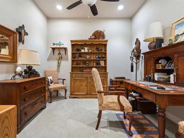 a view of a workspace with furniture