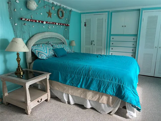 a room with a fireplace and a bed