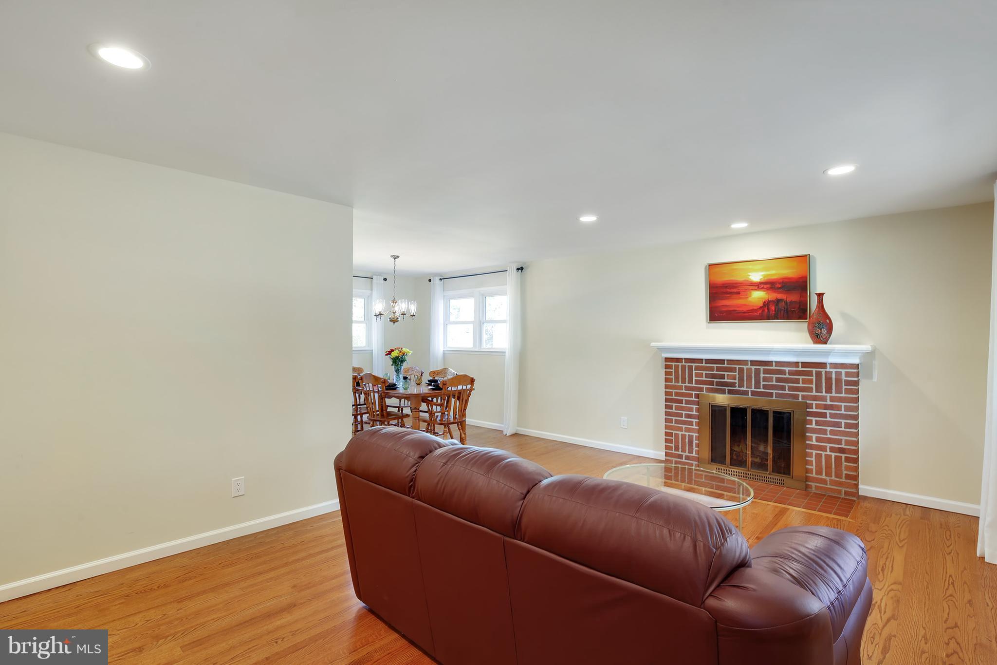 7422 Dunston Street Springfield, VA 22151 - Photo 3 of 30 a living room with furniture and a fireplace