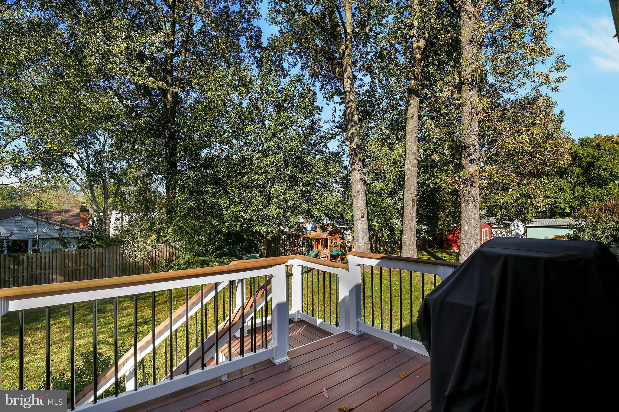 7422 Dunston Street Springfield, VA 22151 - Photo 29 of 30 a view of balcony with wooden floor and fence