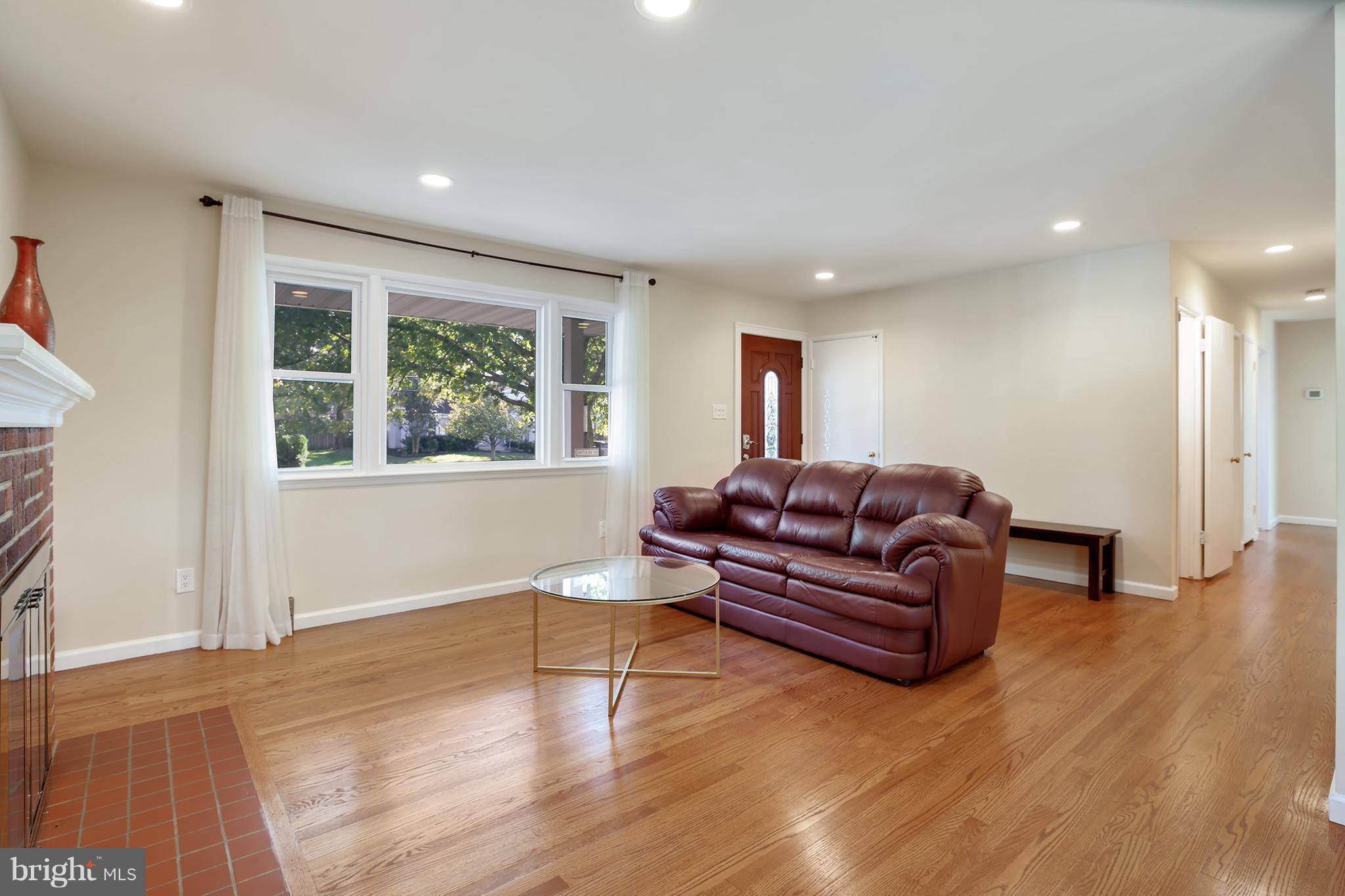 7422 Dunston Street Springfield, VA 22151 - Photo 6 of 30 a living room with furniture and a window