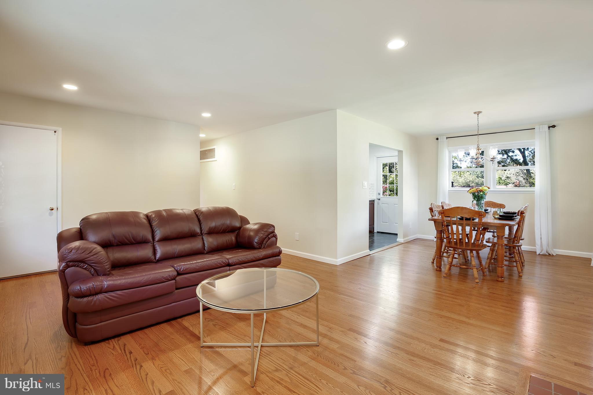 7422 Dunston Street Springfield, VA 22151 - Photo 7 of 30 a living room with furniture and wooden floor