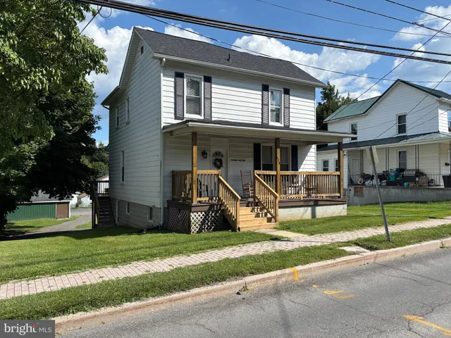 a view of a patio with table and chairs with wooden floor