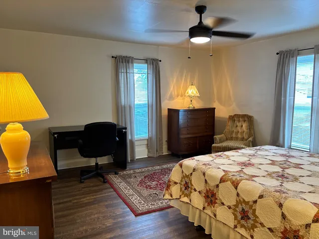 a bedroom with a bed and a fireplace