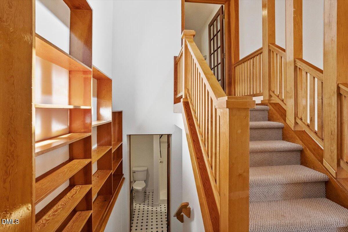 4805 Rembert Drive Raleigh, NC 27612 - Photo 28 of 45 a view of staircase with wooden floor and a window