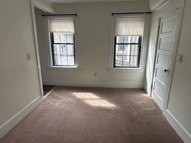 a view of empty room with windows