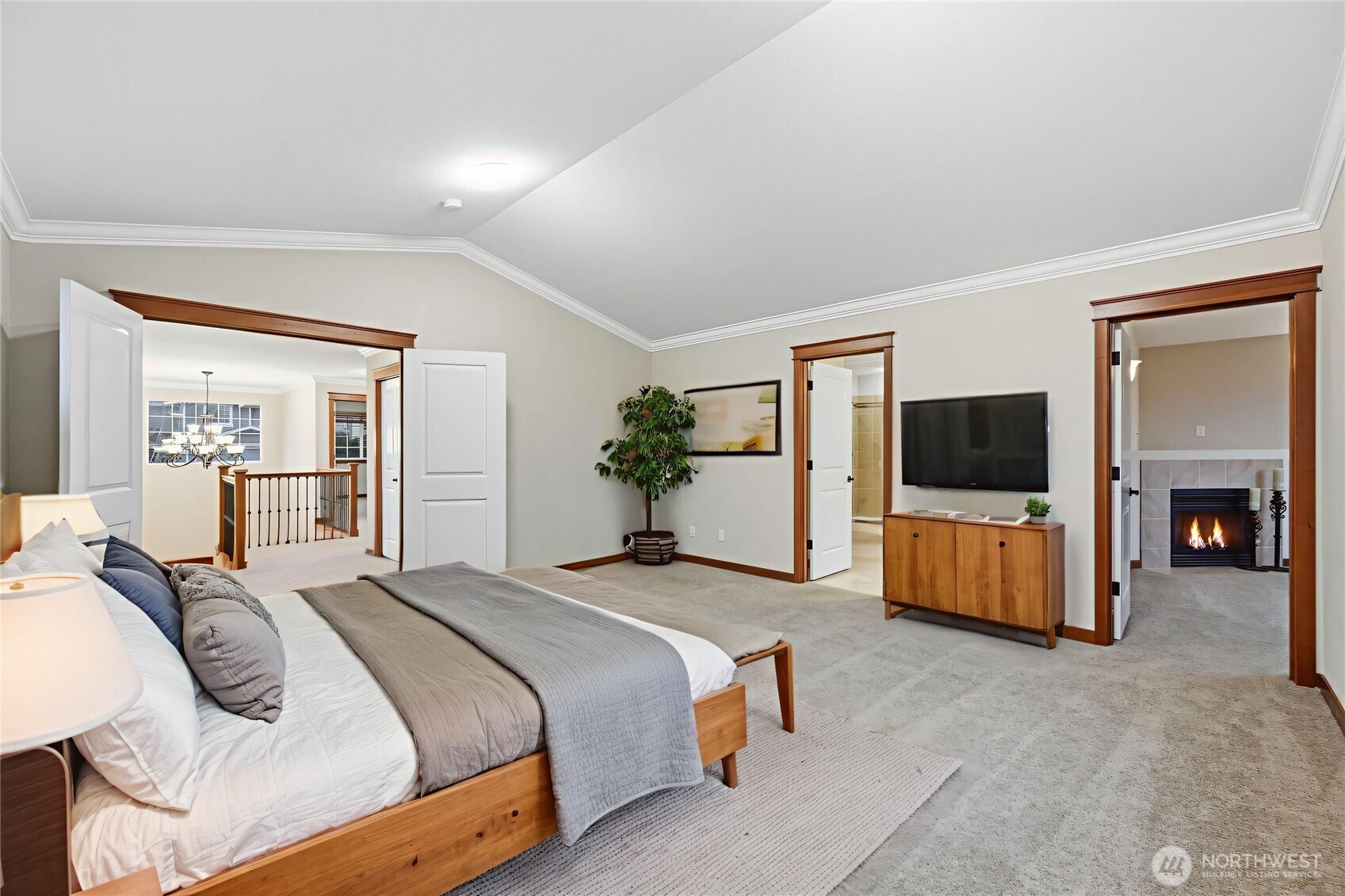 18408 41st Drive Southeast Bothell, WA 98012 - Photo 15 of 25 a spacious bedroom with a bed and a flat screen television