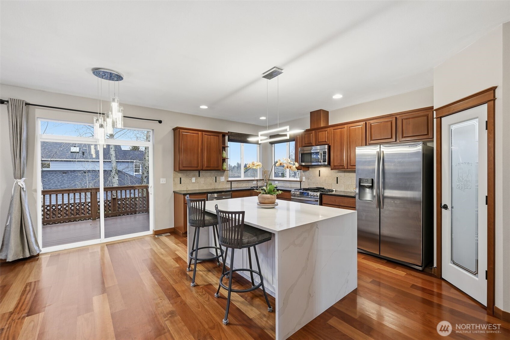 18408 41st Drive Southeast Bothell, WA 98012 - Photo 6 of 25 a kitchen with stainless steel appliances a refrigerator and a stove top oven