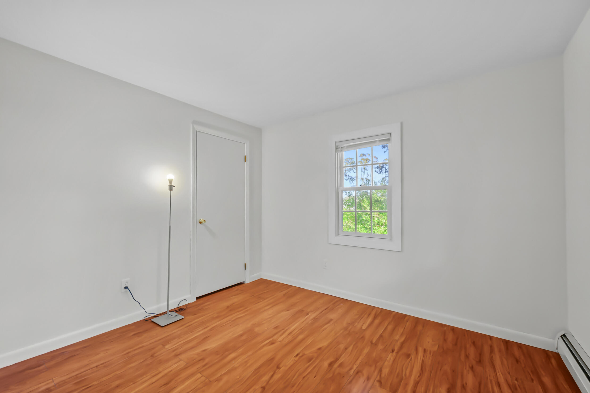 370 Compass Circle Hyannis, MA 02601 - Photo 15 of 26 an empty room with wooden floor and window