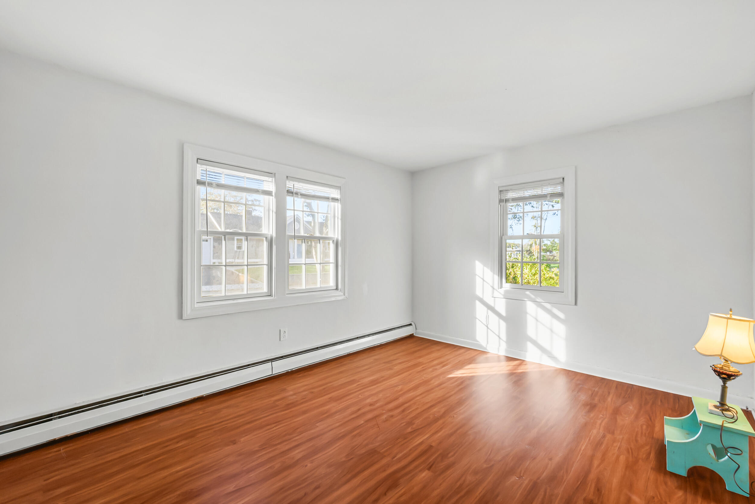 370 Compass Circle Hyannis, MA 02601 - Photo 17 of 26 a view of an empty room with wooden floor and a window