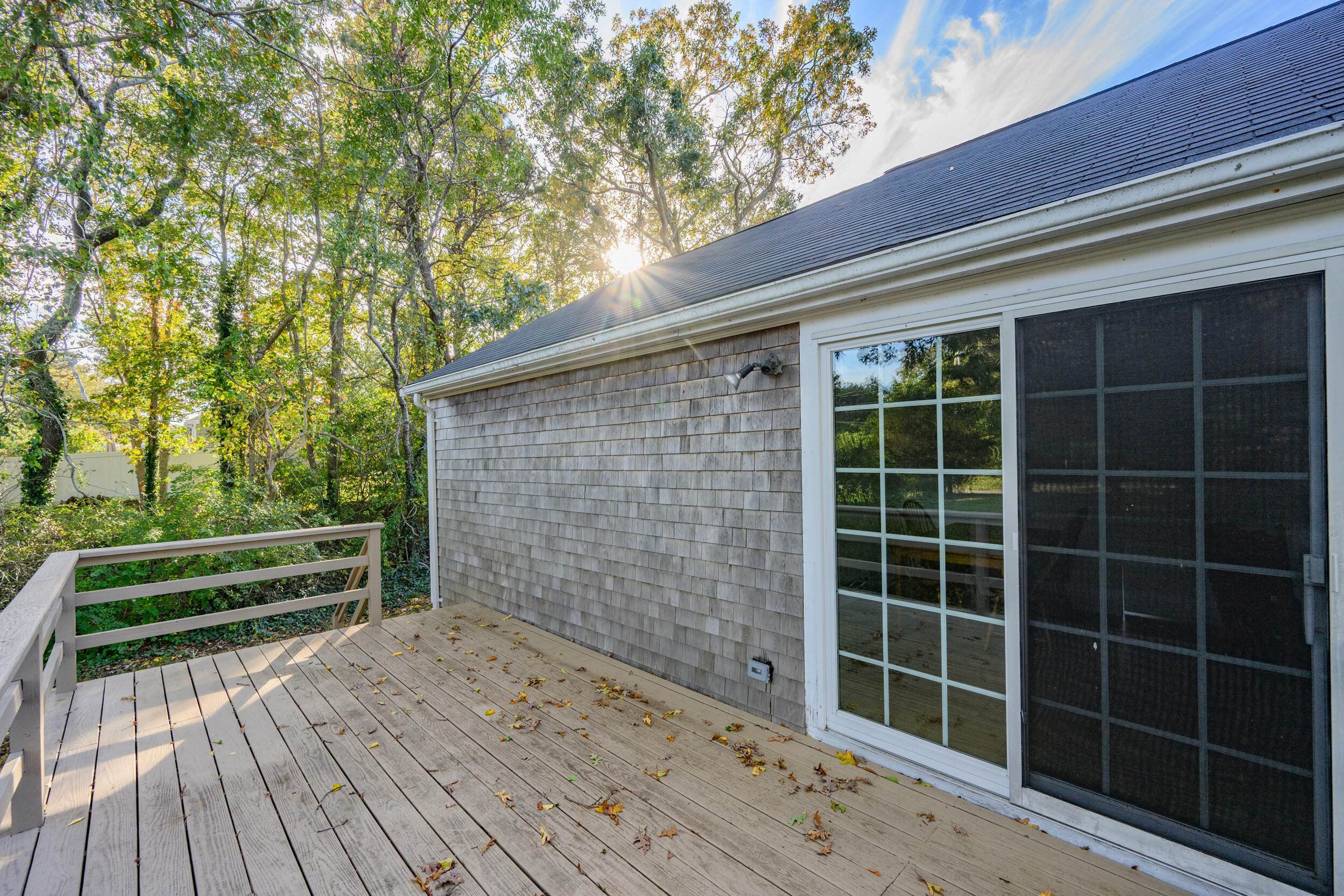 370 Compass Circle Hyannis, MA 02601 - Photo 21 of 26 a view of an empty room with a balcony and wooden floor
