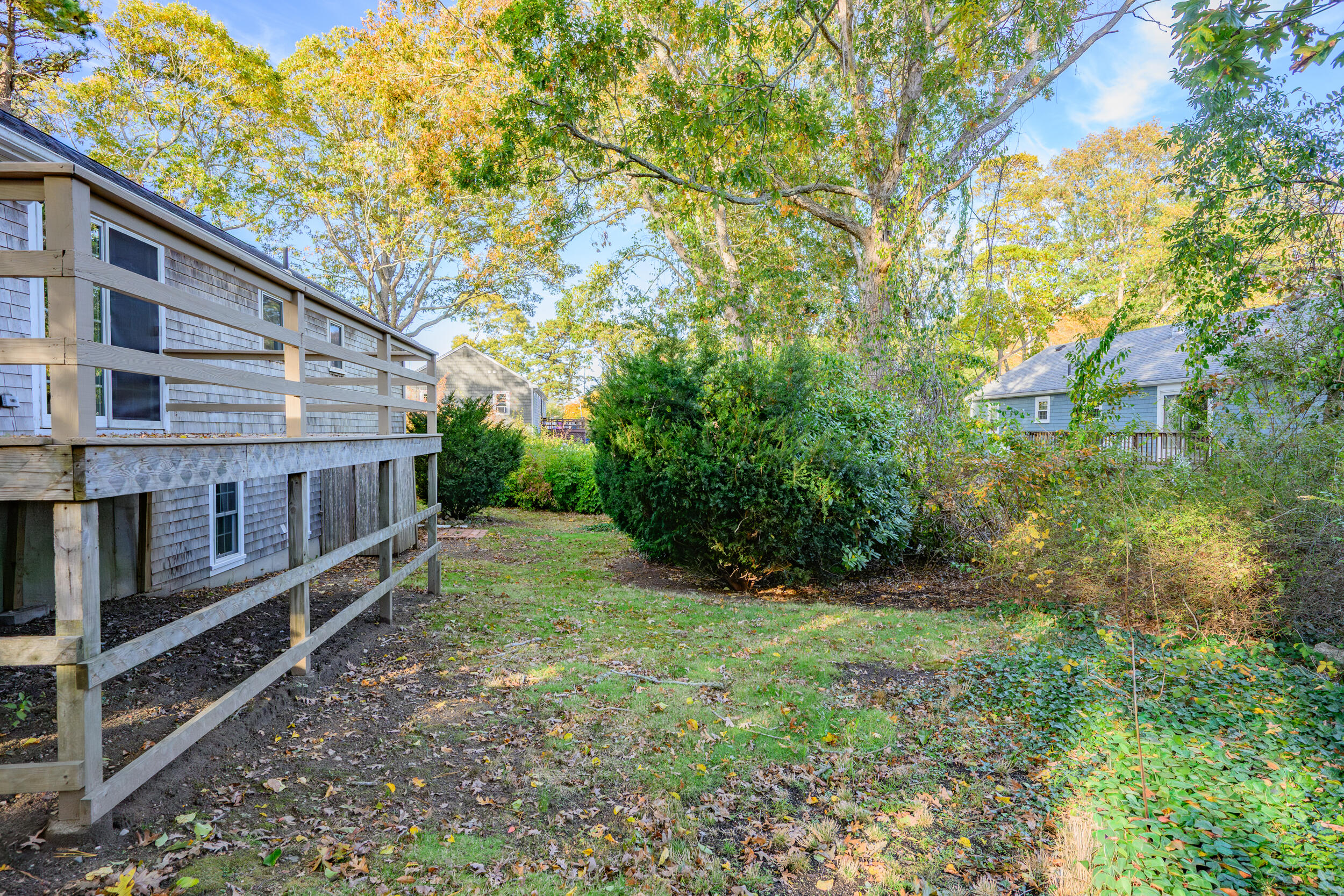 370 Compass Circle Hyannis, MA 02601 - Photo 23 of 26 a view of a house with backyard and trees
