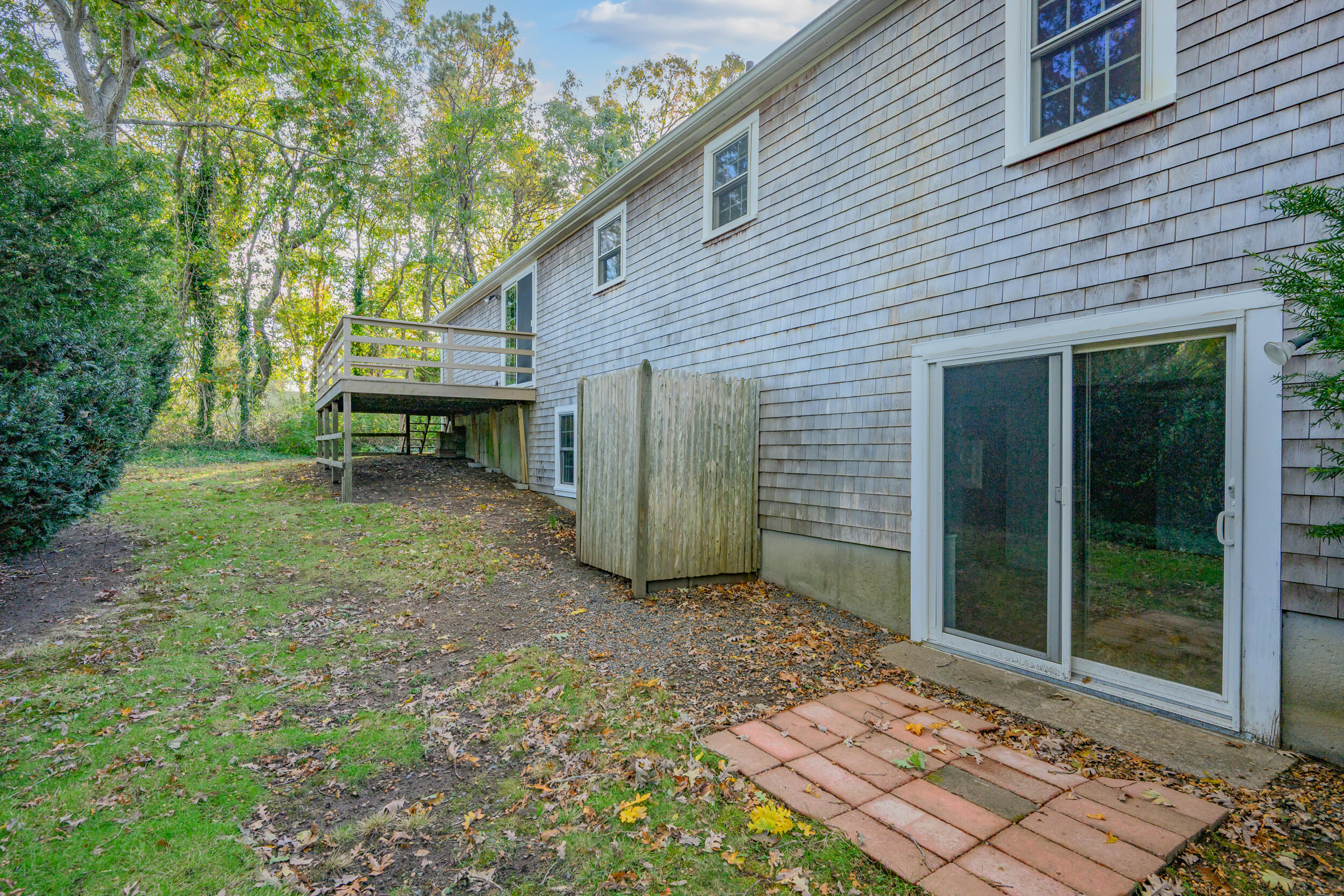 370 Compass Circle Hyannis, MA 02601 - Photo 24 of 26 a view of a backyard with a large tree