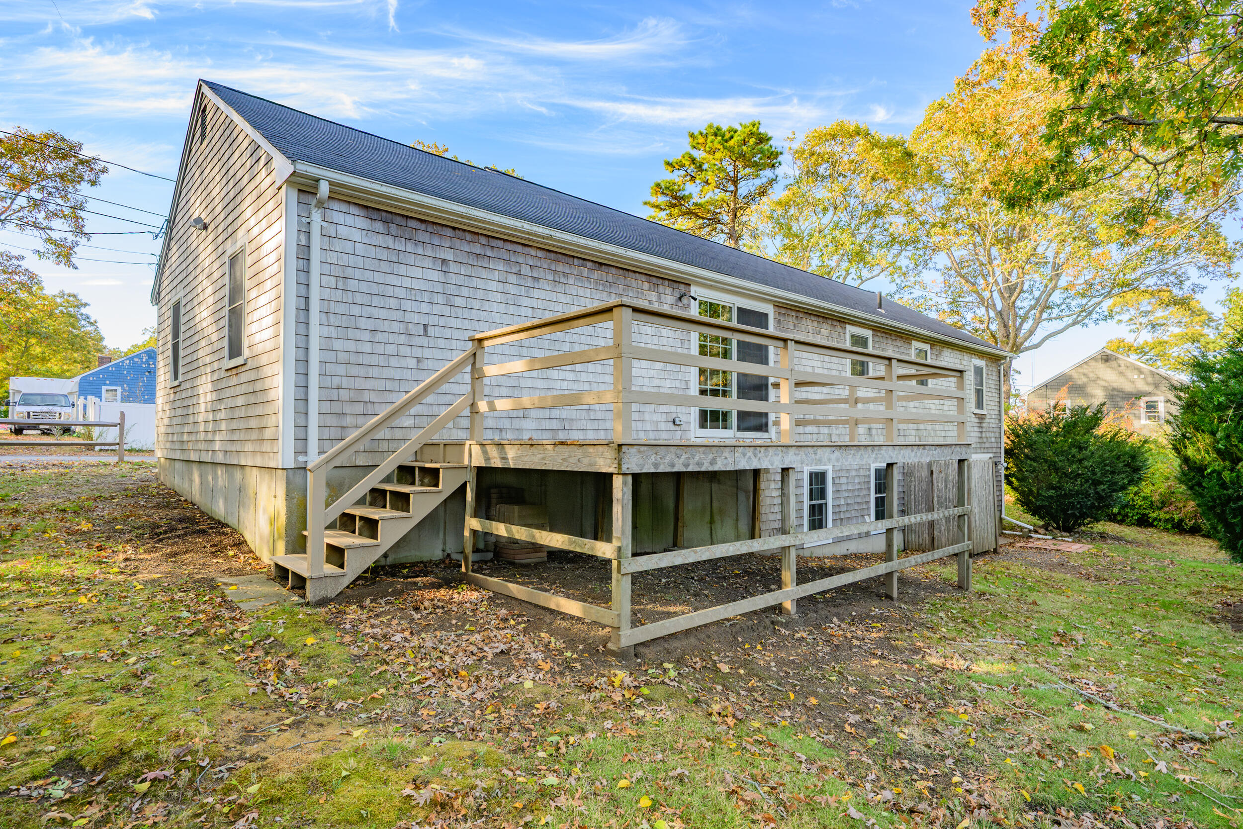 370 Compass Circle Hyannis, MA 02601 - Photo 3 of 26 a view of wooden house with a big yard
