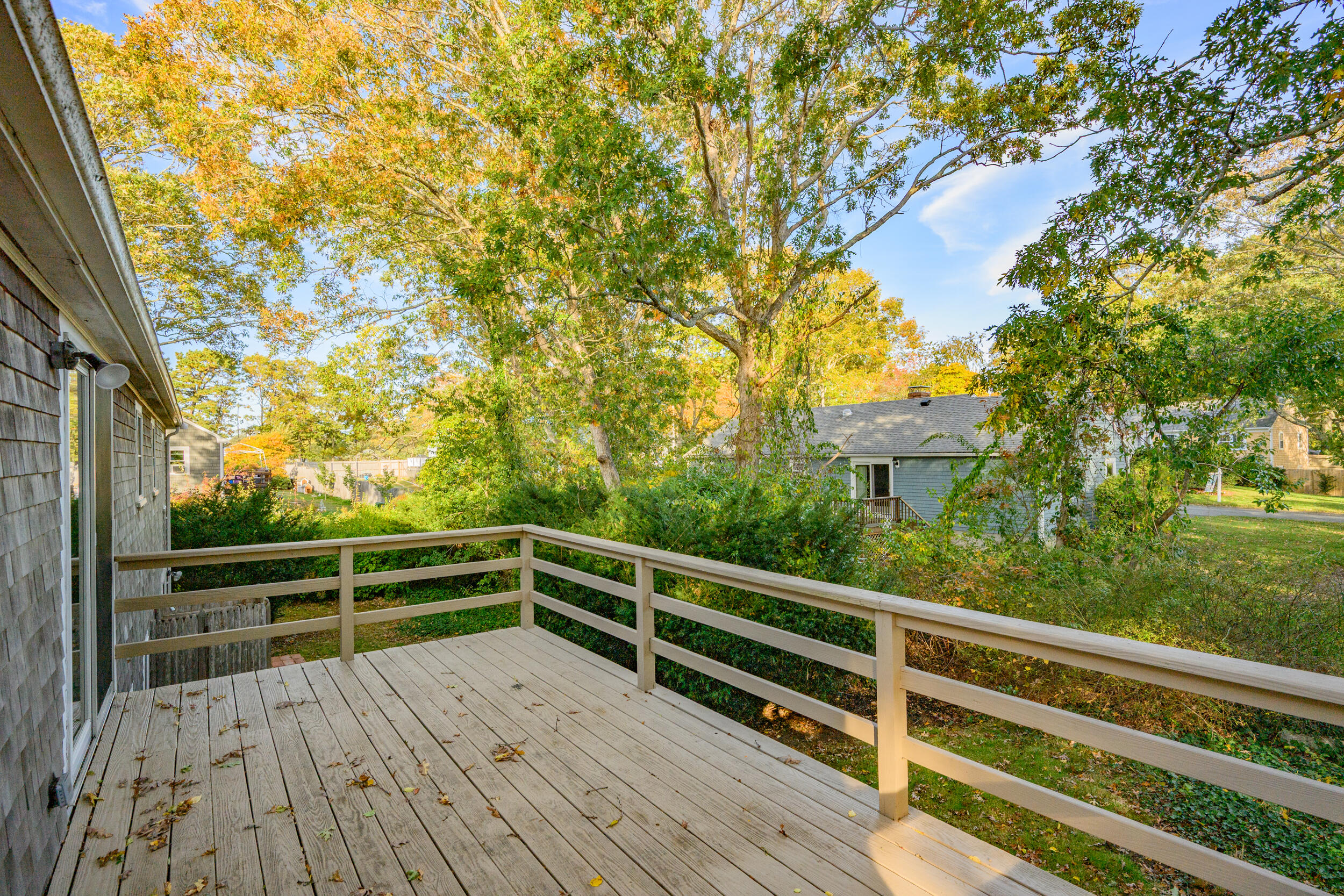 370 Compass Circle Hyannis, MA 02601 - Photo 4 of 26 a view of balcony with wooden floor and fence