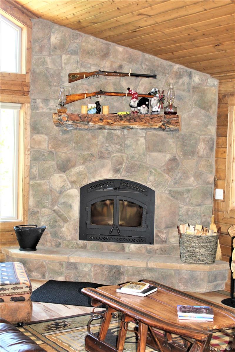 19 Rachaels Place Fairplay, CO 80440 - Photo 9 of 25 a living room with fireplace furniture and a fireplace