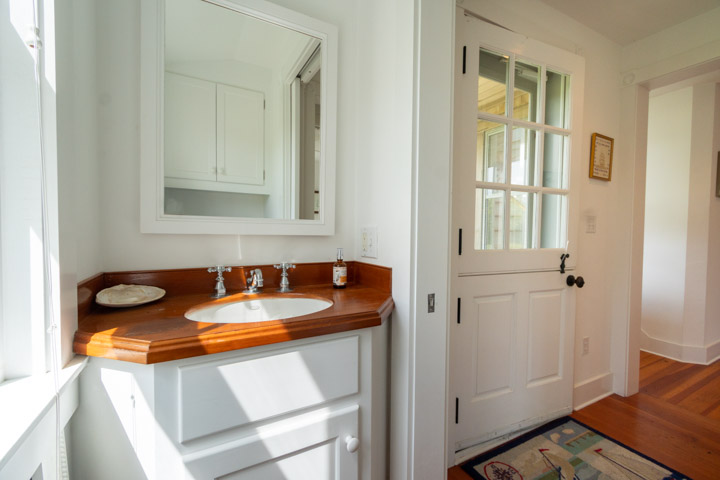 94-21 Tuckernuck Nantucket, MA 02554 - Photo 11 of 20 a bathroom with a sink and a mirror
