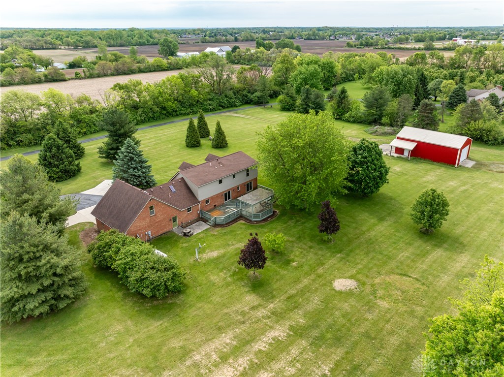 9981 Ridge Acres Lane Englewood, OH 45322 - Photo 68 of 73 This spacious property features a charming home with an expansive yard and a versatile detached outbuilding.