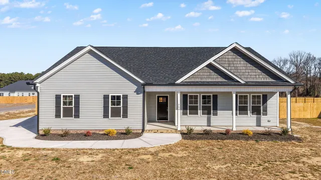 a house with trees in the background