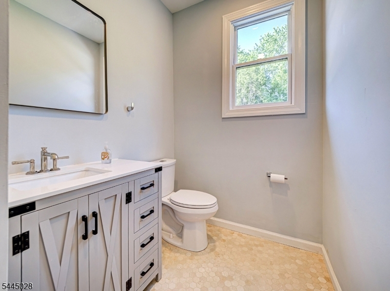 126 Blackwell Road Pennington, NJ 08534 - Photo 15 of 44 a bathroom with a sink a toilet and a mirror