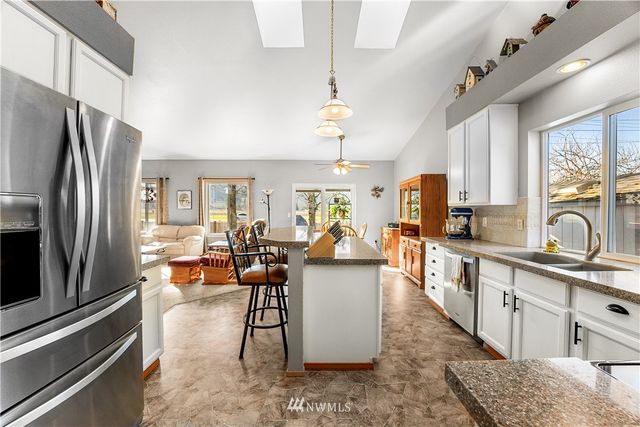 a view of a kitchen and dining room