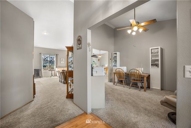 a view of a livingroom with furniture and a chandelier