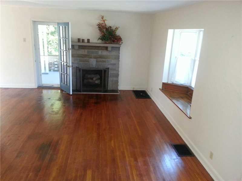 756 Greenlee Road Whitehall, PA 15227 - Photo 2 of 8 Living Room. Living room with bay window seat and french door to covered porch