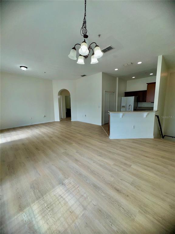 6404 South Goldenrod Road, Unit 2A Orlando, FL 32822 - Photo 34 of 40 a view of a livingroom with a chandelier