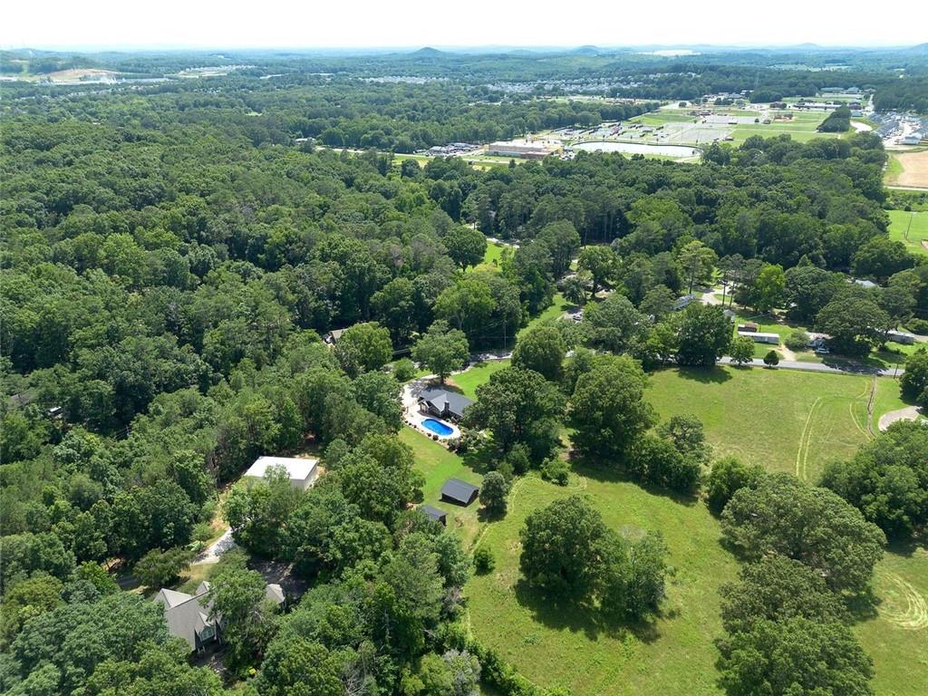 408 Mac Johnson Road Northwest Cartersville, GA 30121 - Photo 73 of 79 an aerial view of a houses with a yard and lake view