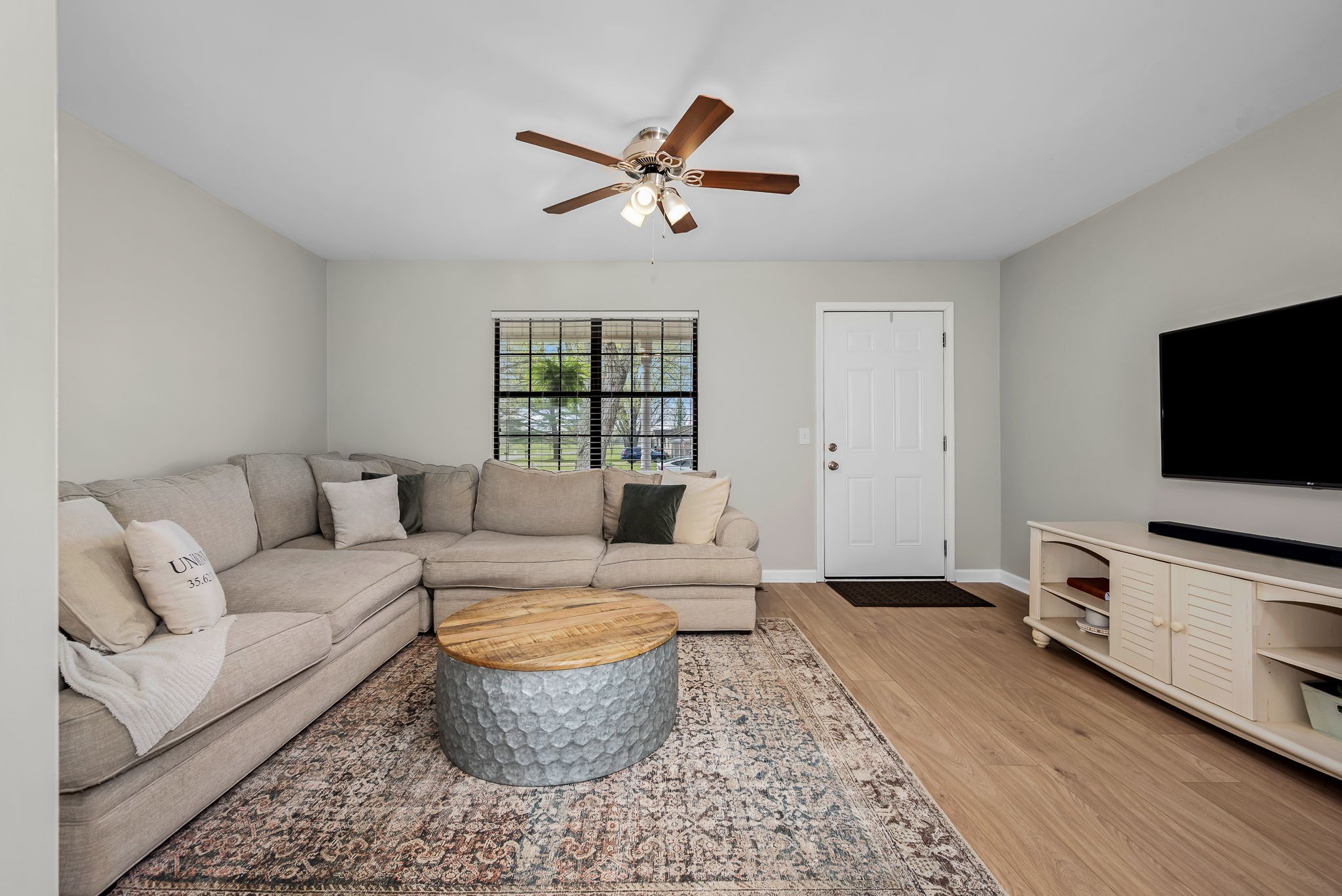 210 Sunset Street Unionville, TN 37180 - Photo 12 of 48 a living room with furniture and a flat screen tv