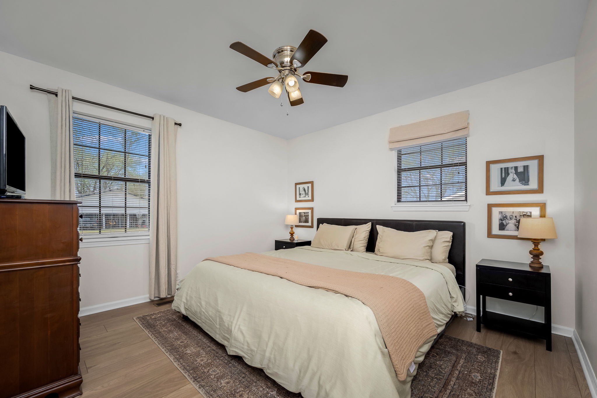 210 Sunset Street Unionville, TN 37180 - Photo 24 of 48 a bedroom with a large bed and a ceiling fan