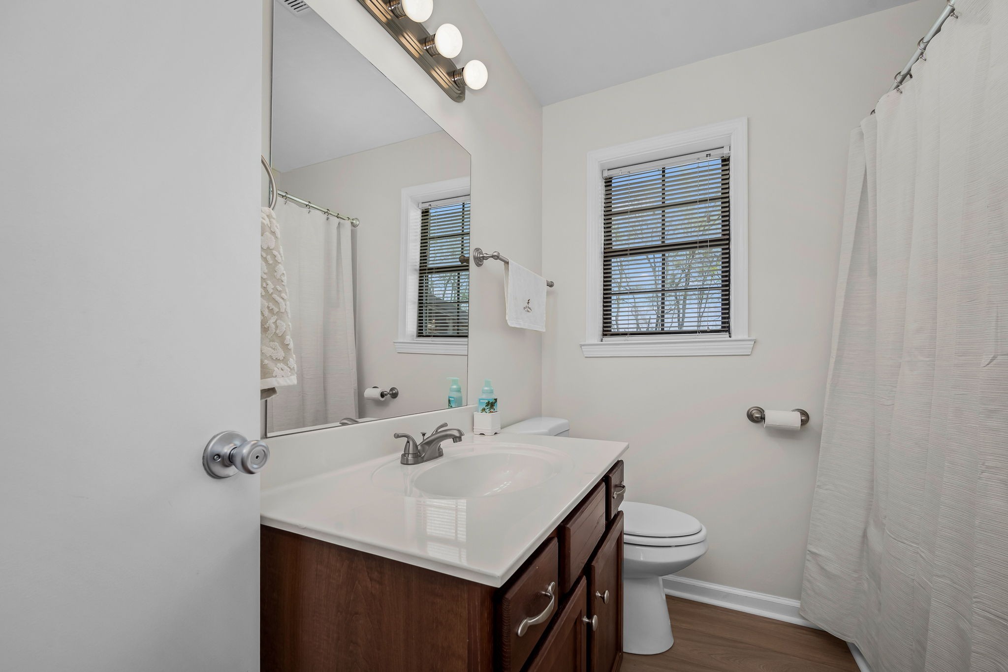 210 Sunset Street Unionville, TN 37180 - Photo 26 of 48 a bathroom with a sink toilet and mirror