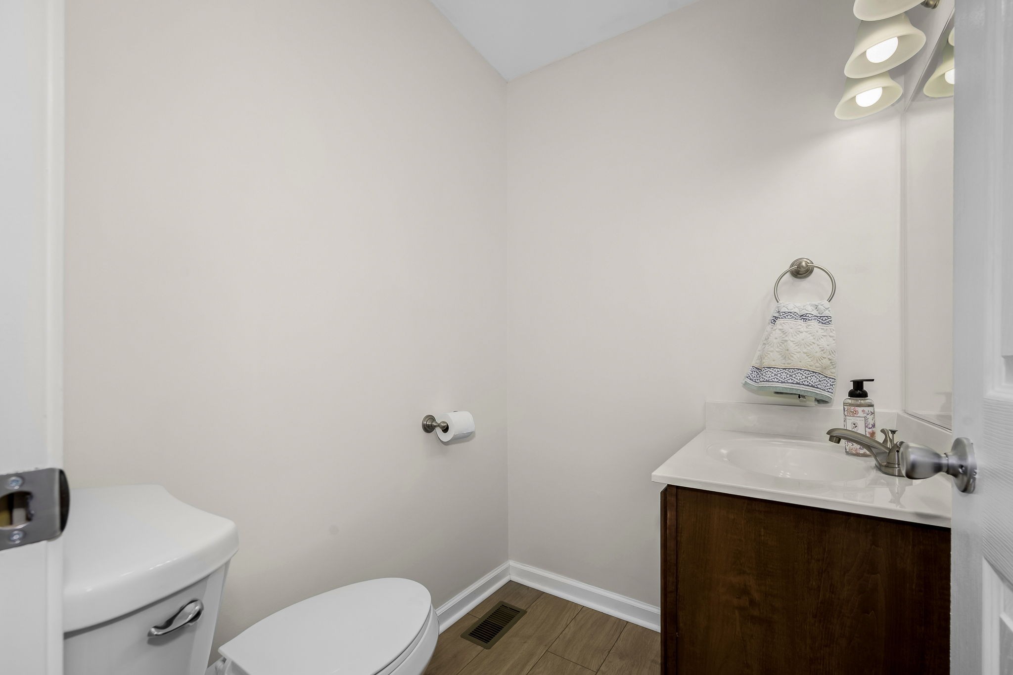 210 Sunset Street Unionville, TN 37180 - Photo 34 of 48 a bathroom with a sink mirror vanity and toilet