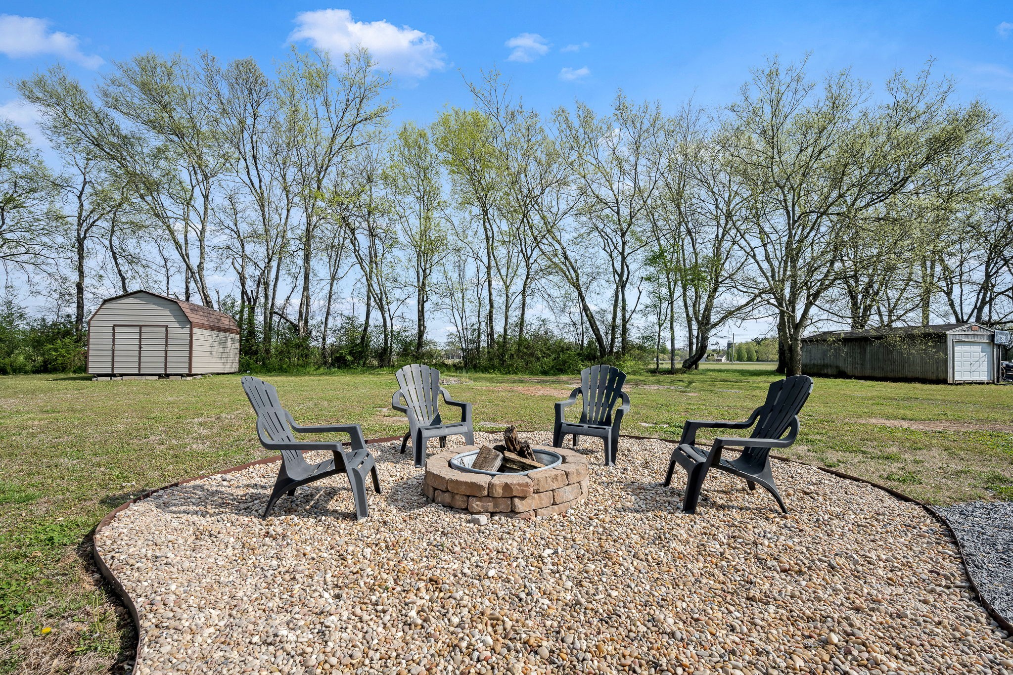 210 Sunset Street Unionville, TN 37180 - Photo 39 of 48 a view of a garden with chairs in patio