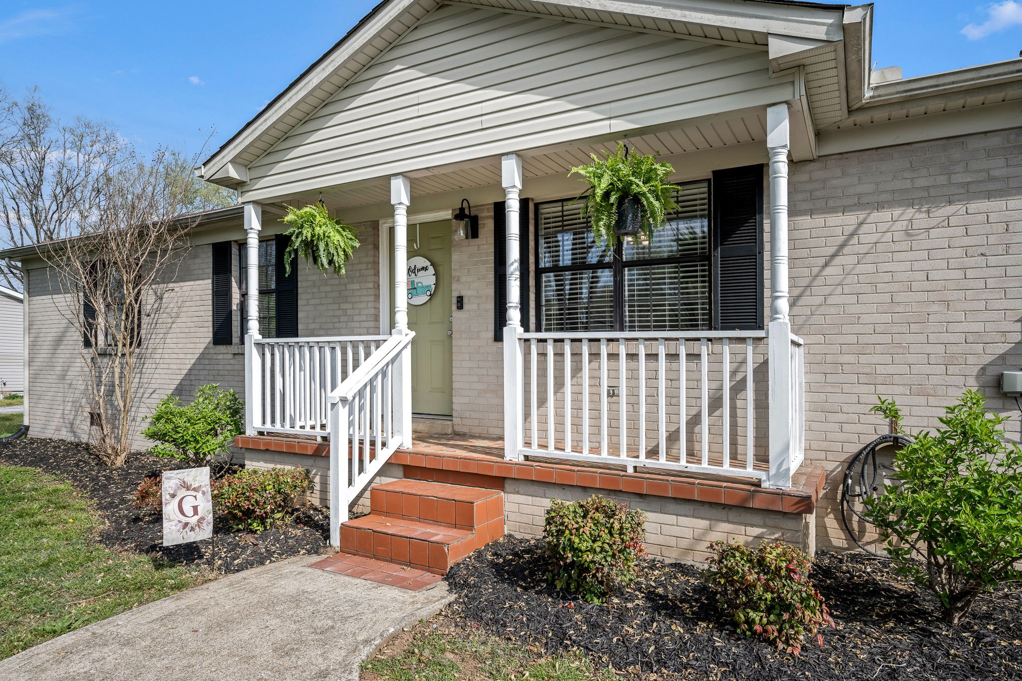 210 Sunset Street Unionville, TN 37180 - Photo 8 of 48 front view of a house with a porch