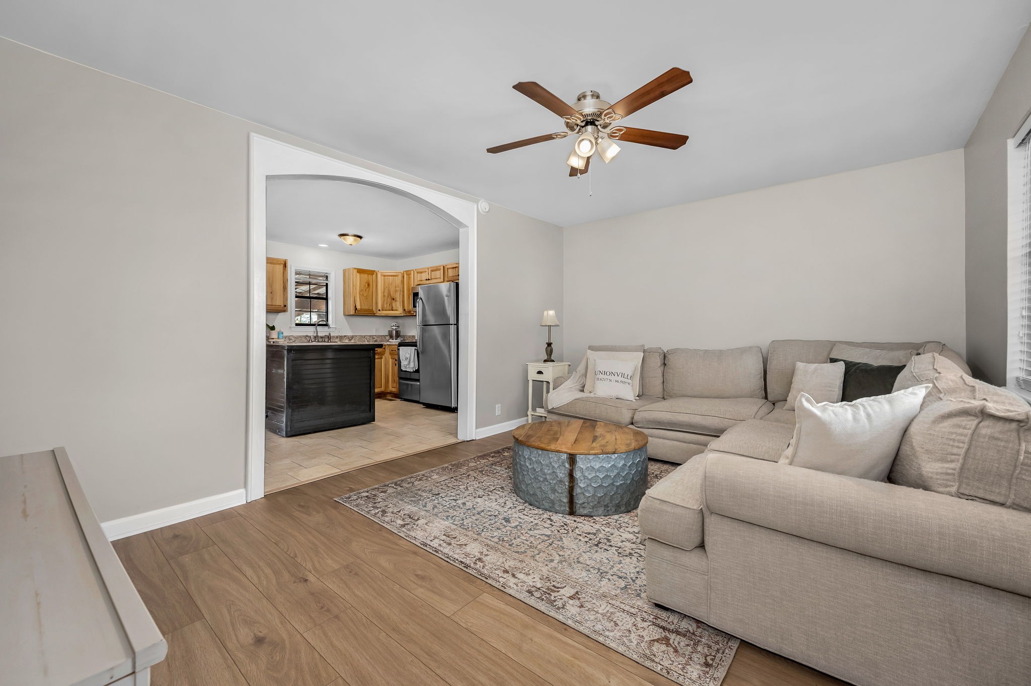 210 Sunset Street Unionville, TN 37180 - Photo 9 of 48 a living room with furniture and a chandelier