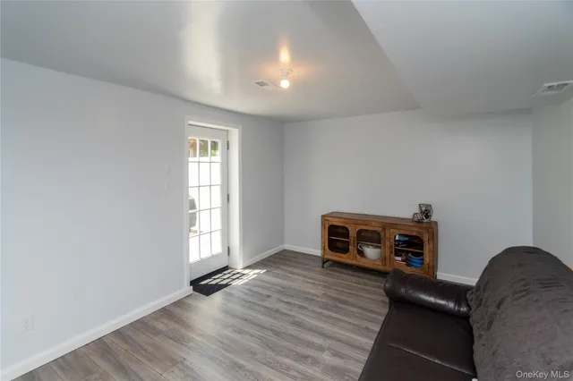 a living room with a couch and a window