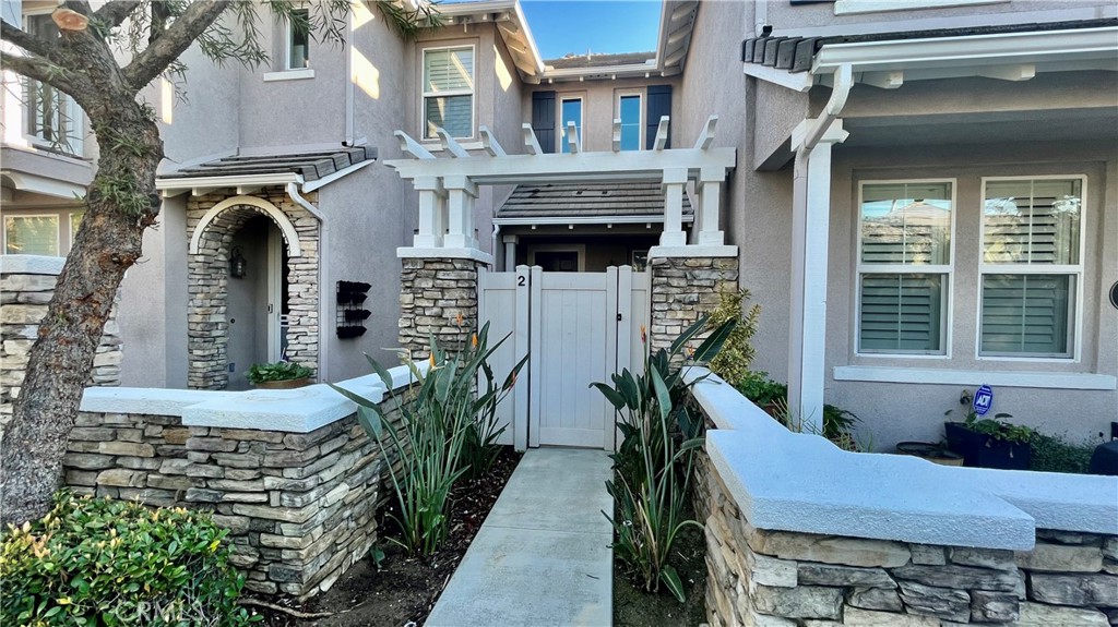 a view of front door and small houses