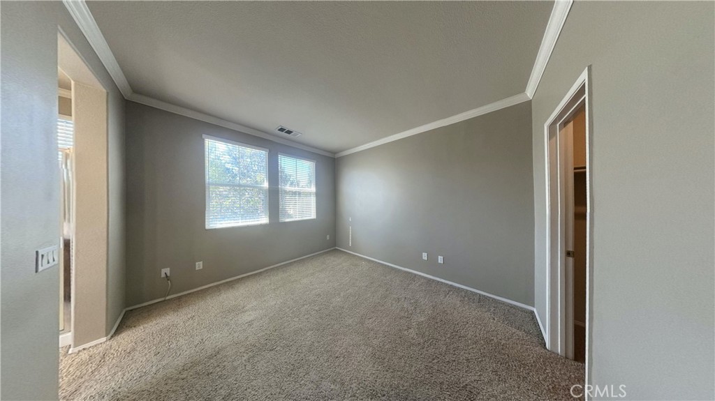 7701 Chambray Place, Unit 2 Rancho Cucamonga, CA 91739 - Photo 12 of 39 an empty room with windows