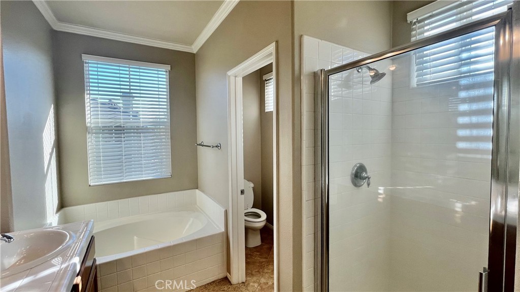 7701 Chambray Place, Unit 2 Rancho Cucamonga, CA 91739 - Photo 14 of 39 a bathroom with a bathtub and a shower