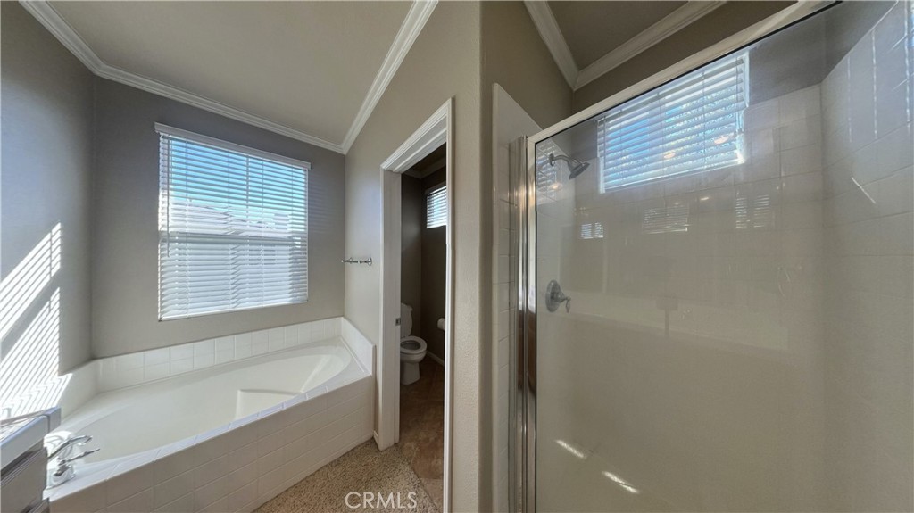7701 Chambray Place, Unit 2 Rancho Cucamonga, CA 91739 - Photo 18 of 39 a bathroom with a bathtub and a shower