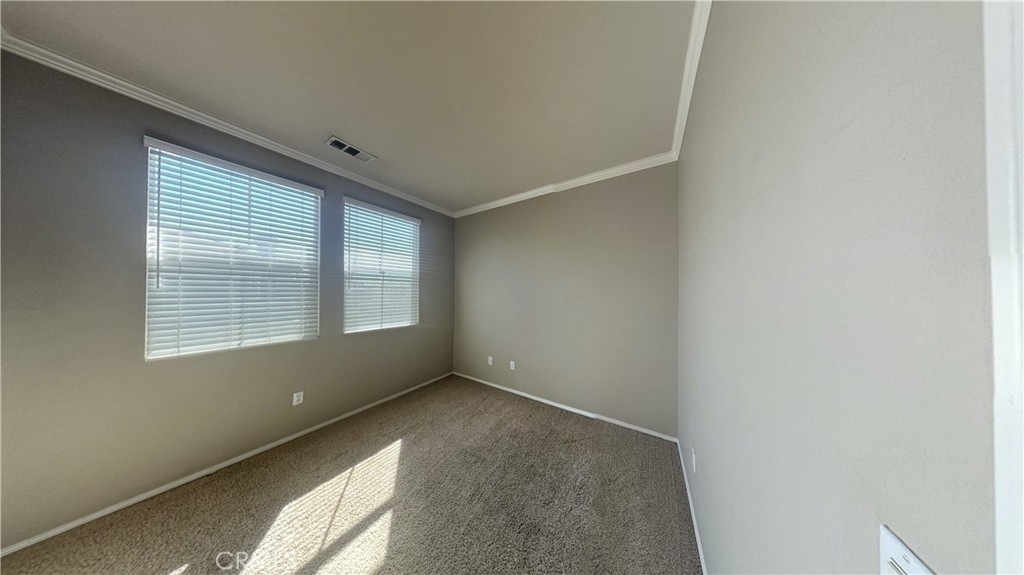 7701 Chambray Place, Unit 2 Rancho Cucamonga, CA 91739 - Photo 22 of 39 a view of an empty room with a window