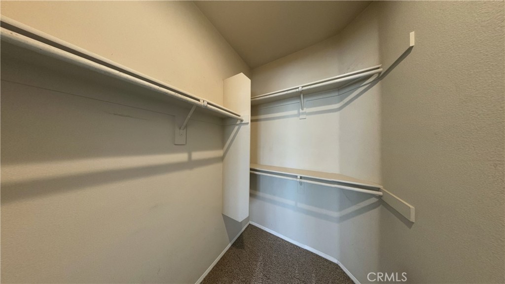 7701 Chambray Place, Unit 2 Rancho Cucamonga, CA 91739 - Photo 23 of 39 a view of an empty walk in closet