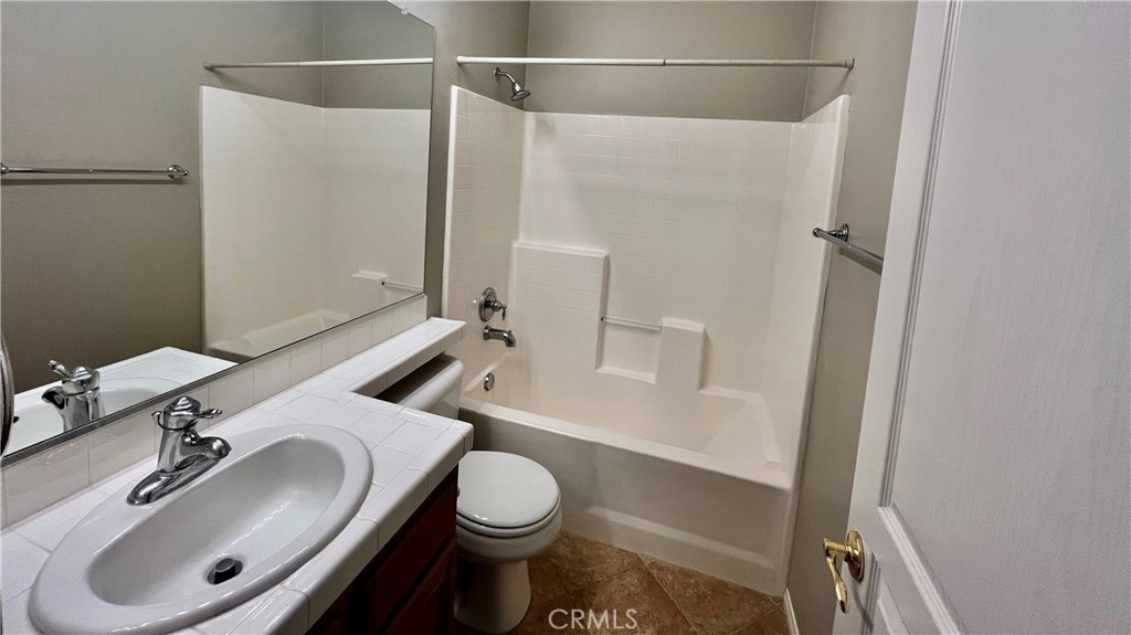7701 Chambray Place, Unit 2 Rancho Cucamonga, CA 91739 - Photo 24 of 39 a bathroom with a sink toilet and shower