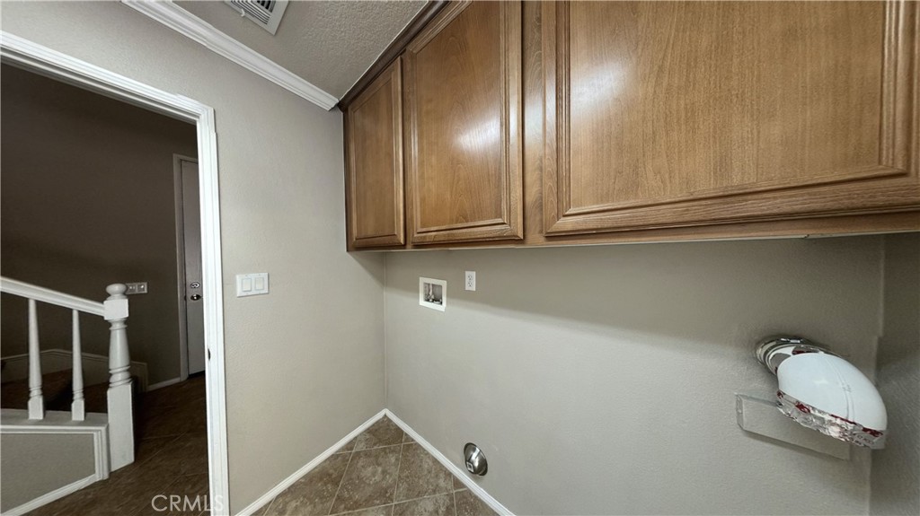 7701 Chambray Place, Unit 2 Rancho Cucamonga, CA 91739 - Photo 26 of 39 a view of a livingroom with washer and dryer