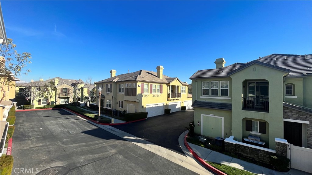7701 Chambray Place, Unit 2 Rancho Cucamonga, CA 91739 - Photo 30 of 39 a view of a house with a yard
